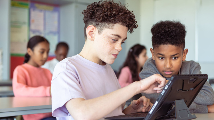 Teens using a tablet computer 