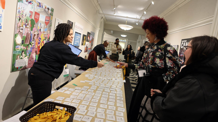 Woman handing out nametags