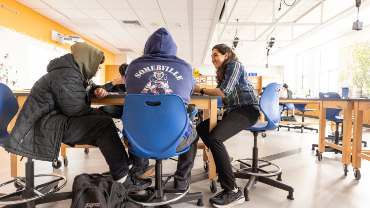Photo of Akanksha Pabari working with Somerville High School students