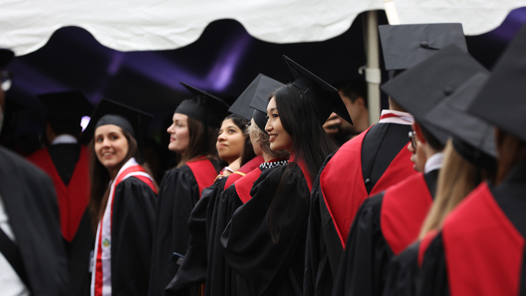 Graduate about to enter tent