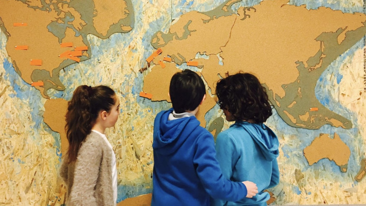 Students looking at a map