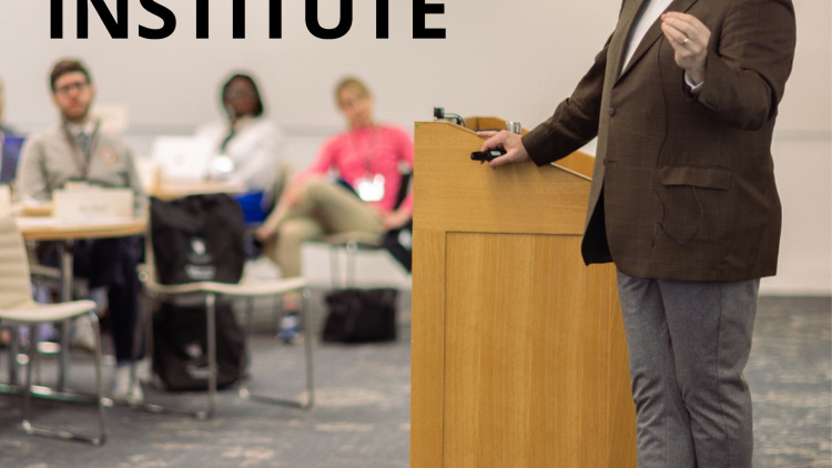Faculty Chair Timothy McCarthy speaking during institute on campus with colorful BRAVE logo