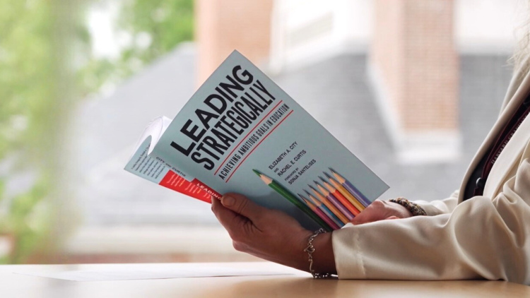 Person reading Leading Strategically book