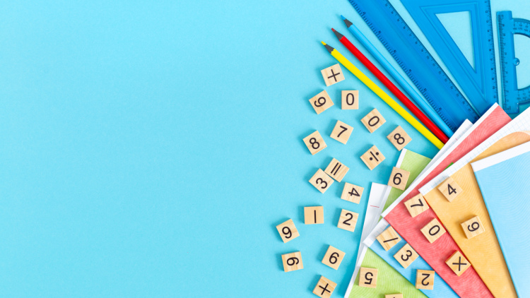 Bright multicolored school supplies, stationery on a blue background