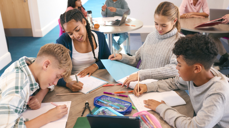 High school students drawing and writing together