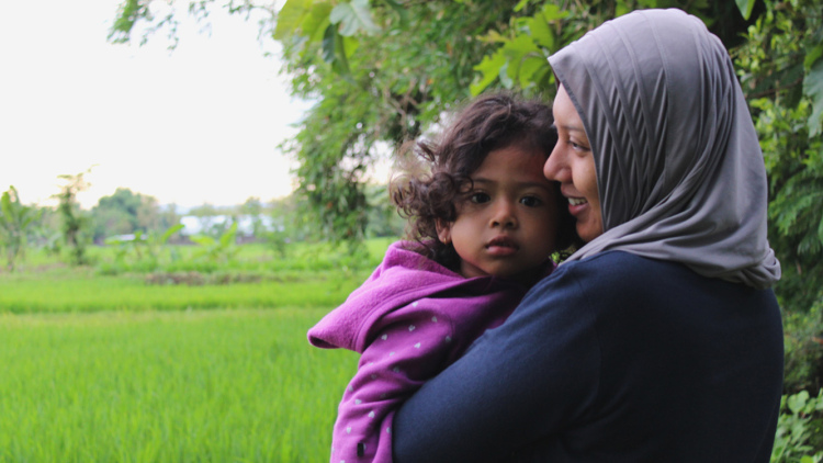 Mother holding child