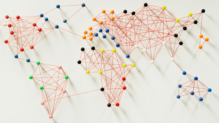 Pins and string making a map of the world 