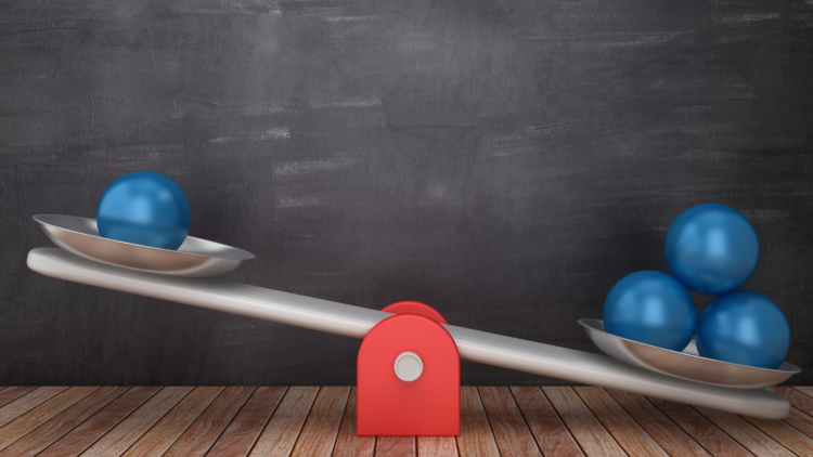 seesaw scale with uneven weights, suggesting unfair advantage