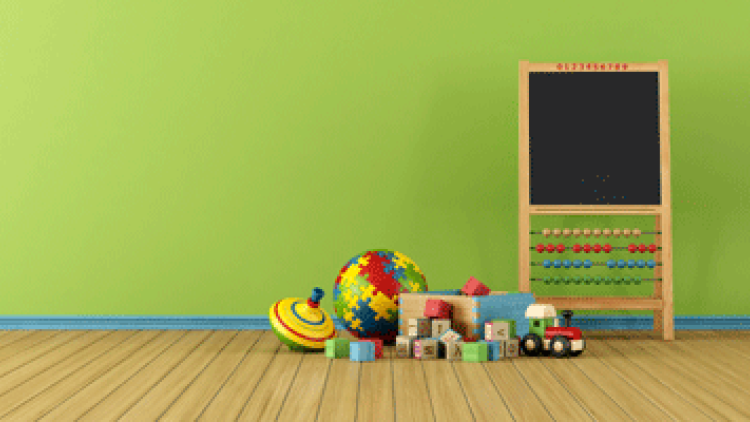 An easel and toys in an early education classroom