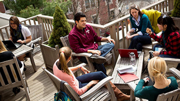 Students working together on outdoor terrace