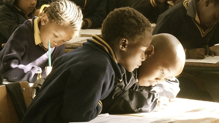 3 boys in a classroom