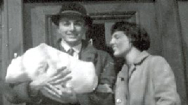 Dick and Meg with their son on the steps of their Chauncy Street apartment in 1962