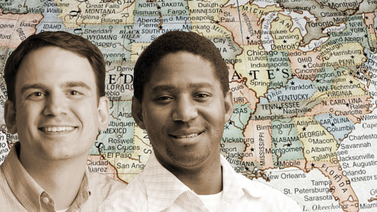 Ryan Wise and Ryan Stewart in front of U.S. map