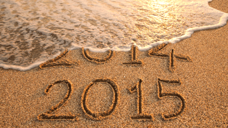 photo of a beach with 2014 and 2015 written in sand