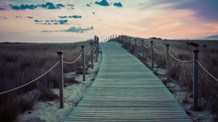 pathway leading to beach and sunset
