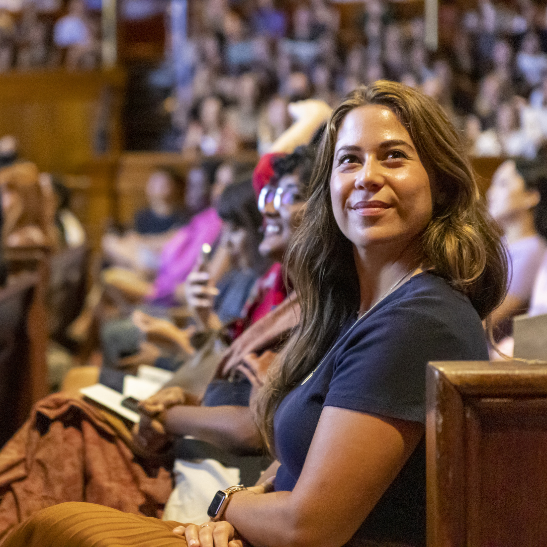 Incoming HGSE students sit in Sanders Theatre