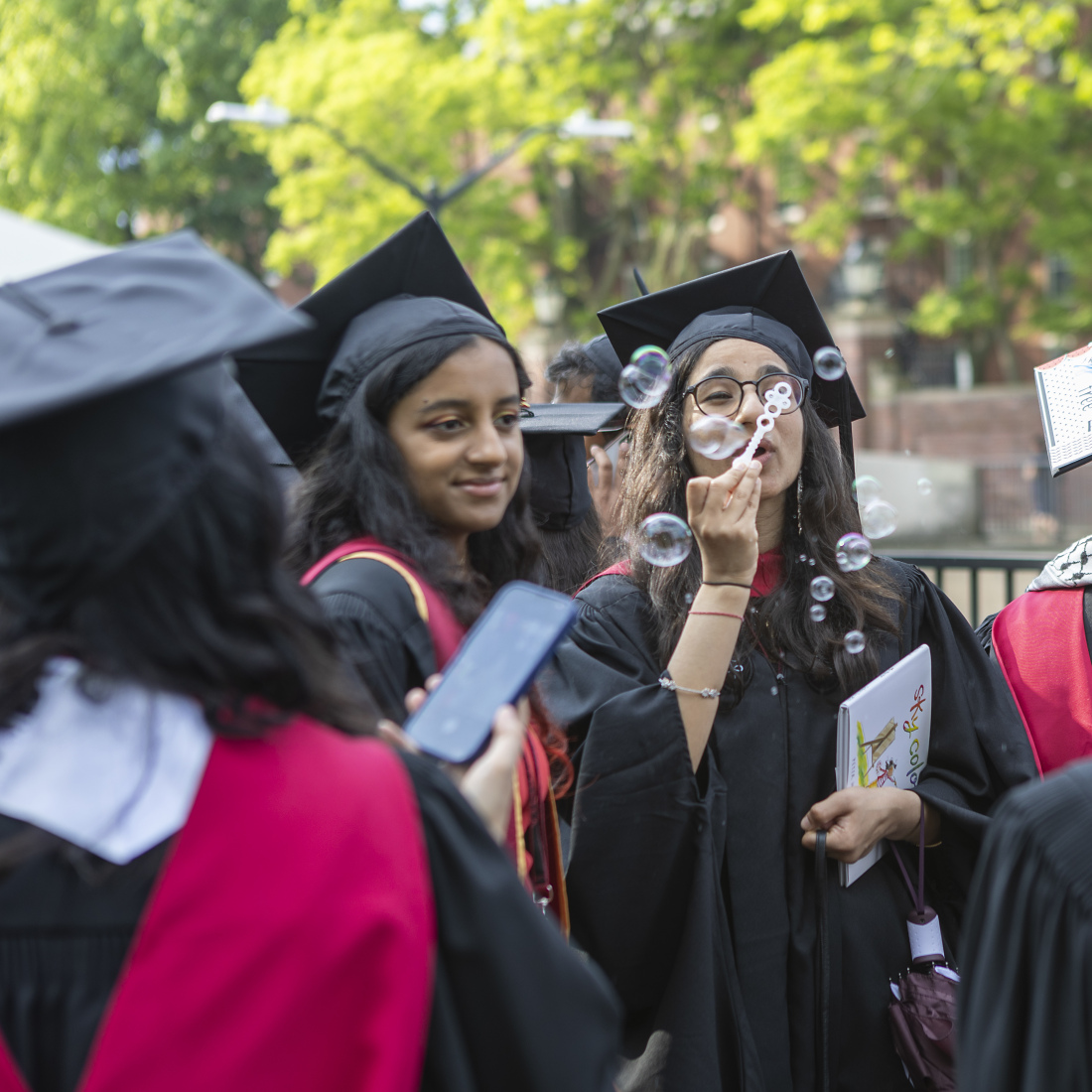 Graduate blowing bubbles