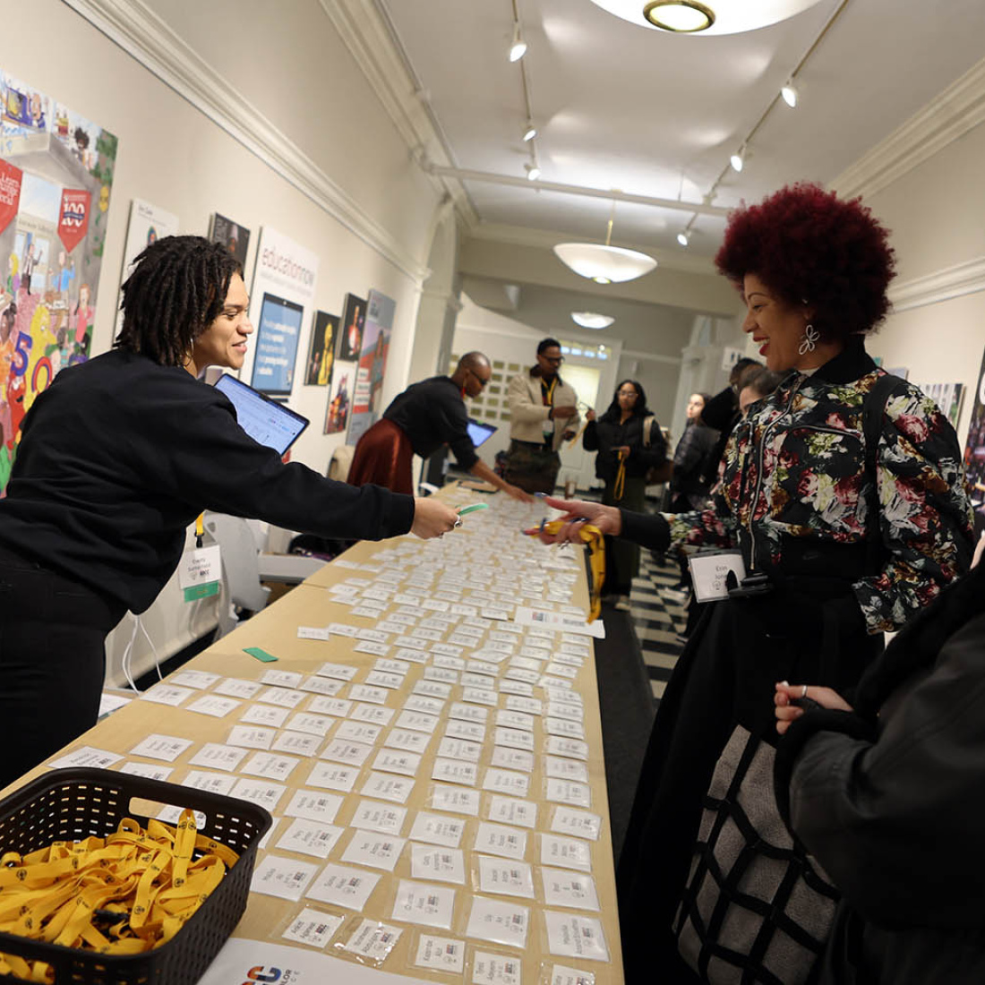 Woman handing out nametags