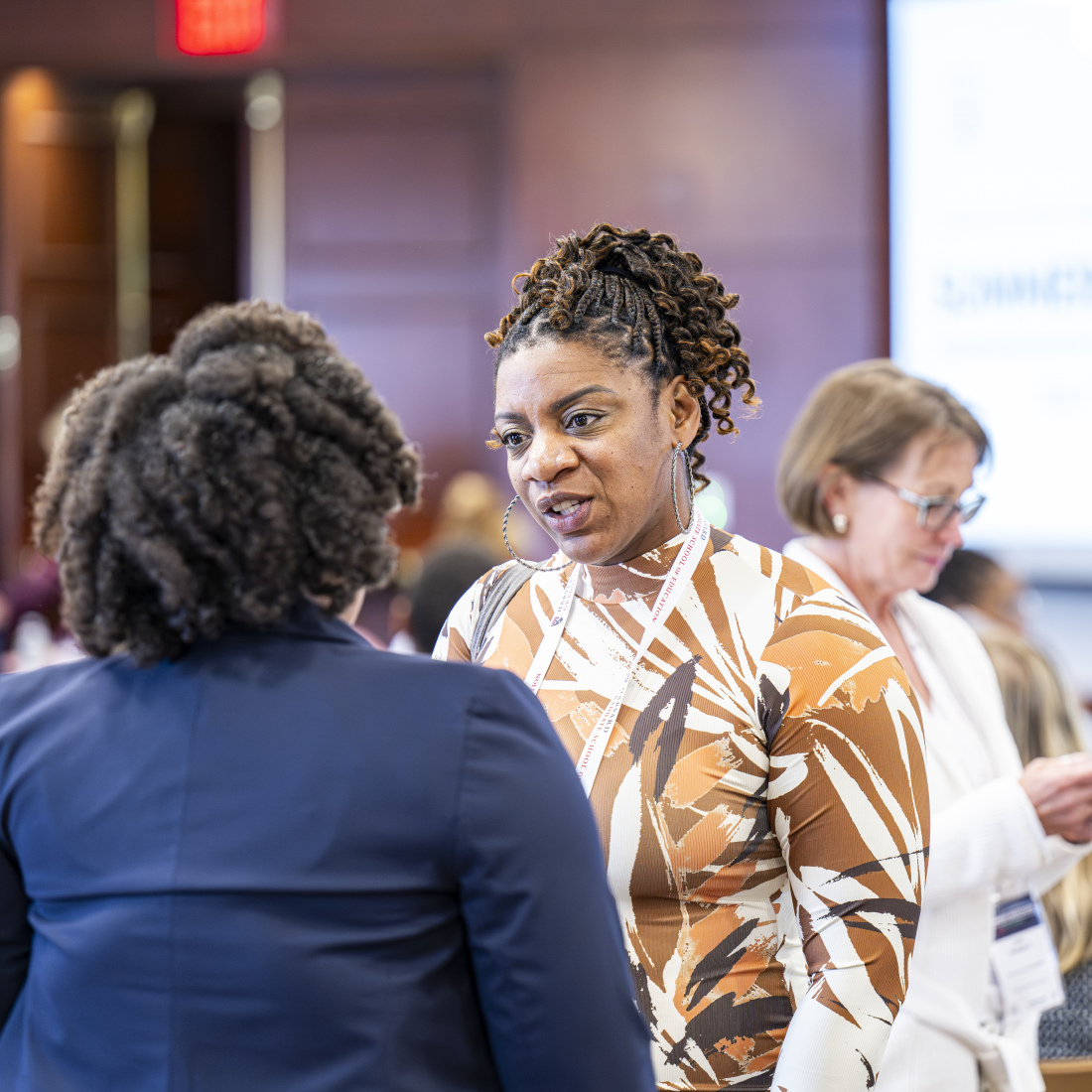 Attendees at the EdRedesign Summer Institute have a conversation