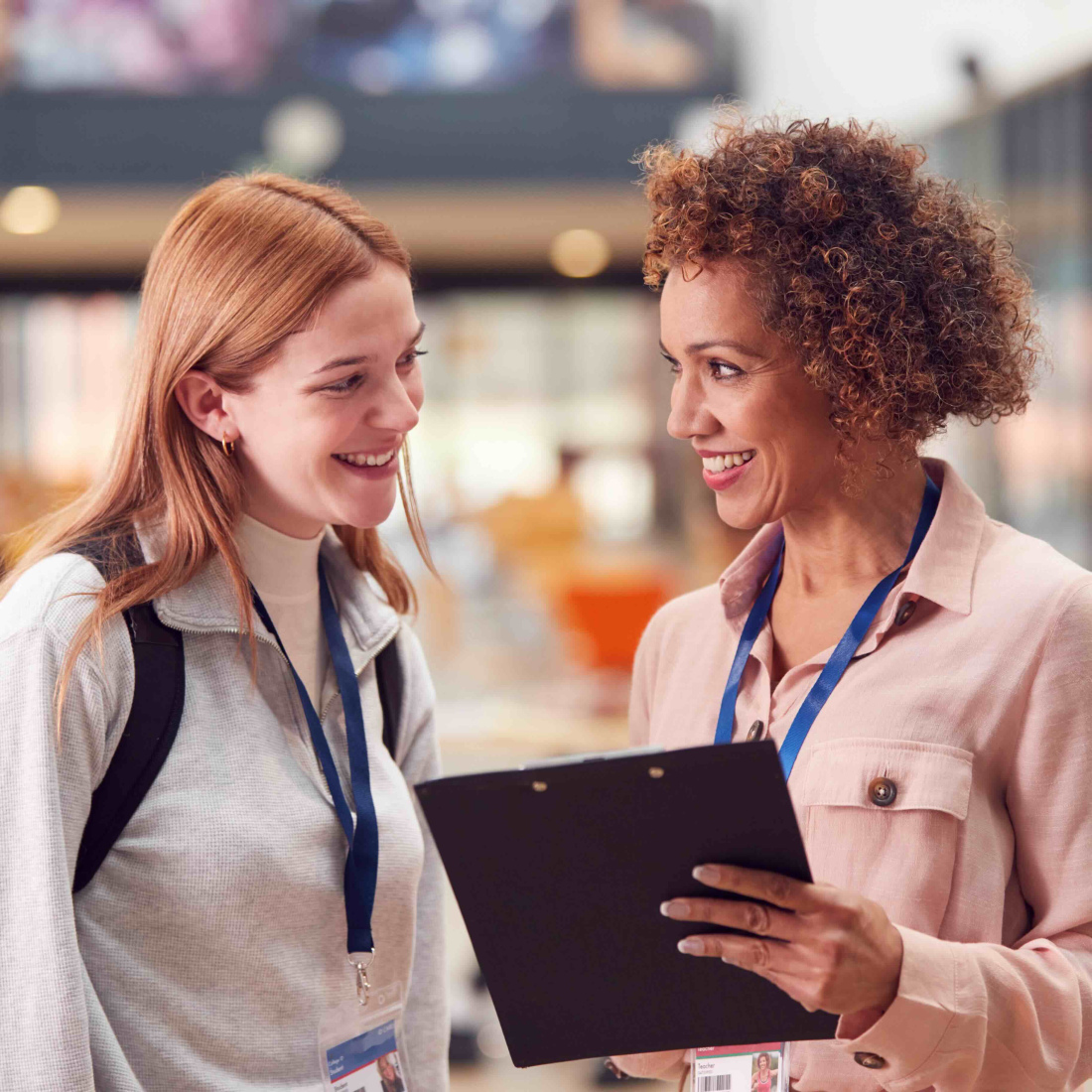 Two women meeting in school building