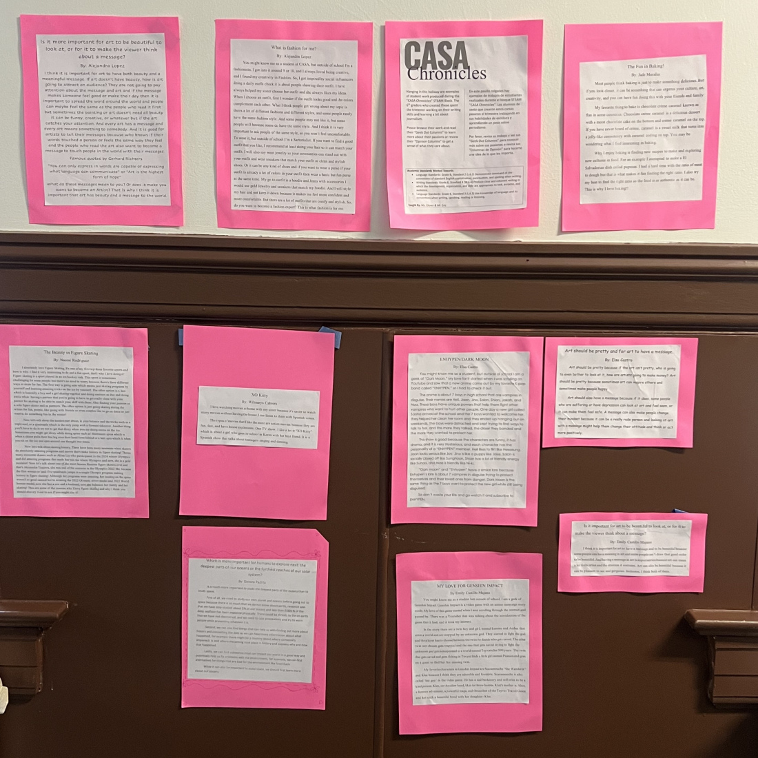 pages from the CASA Chronicles displayed on a wall