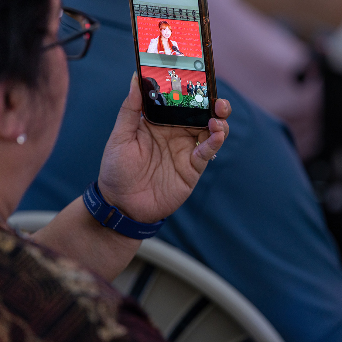 Woman filming speech