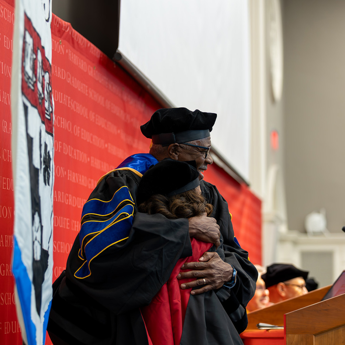 Shawn Ginwright hugging graduate