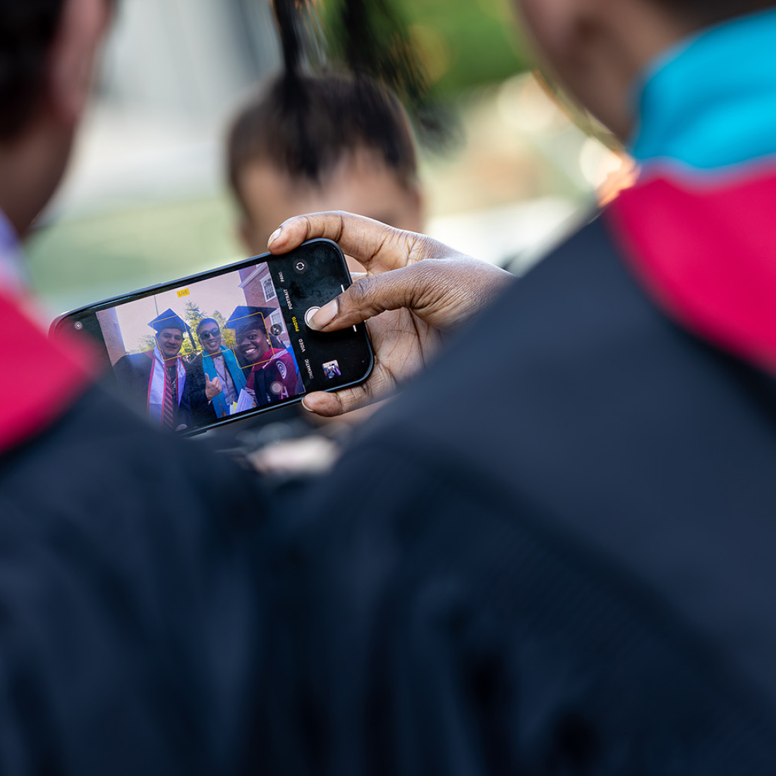 Graduates on phone