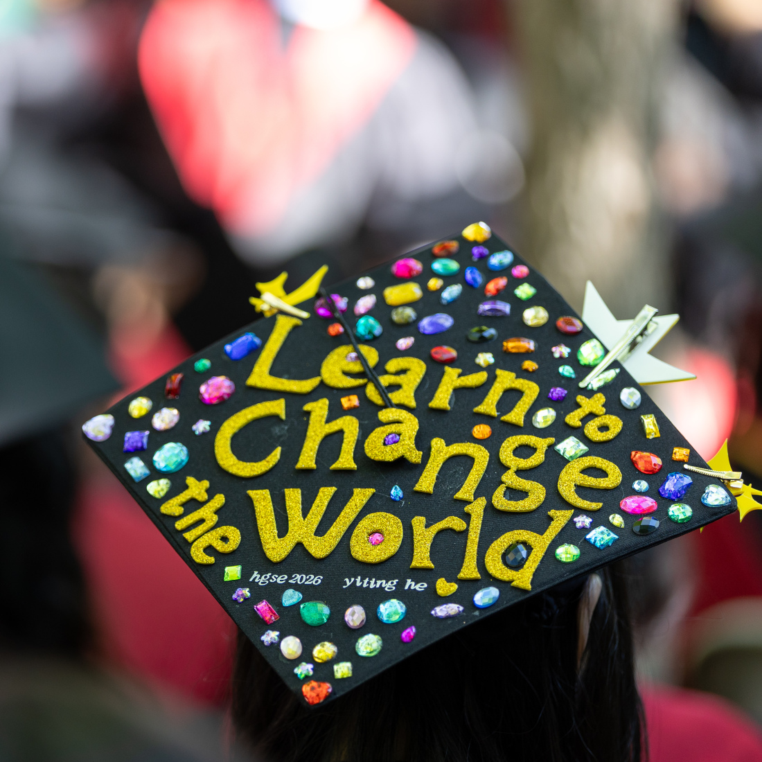 A graduation cap that says "Learn to Change the World"