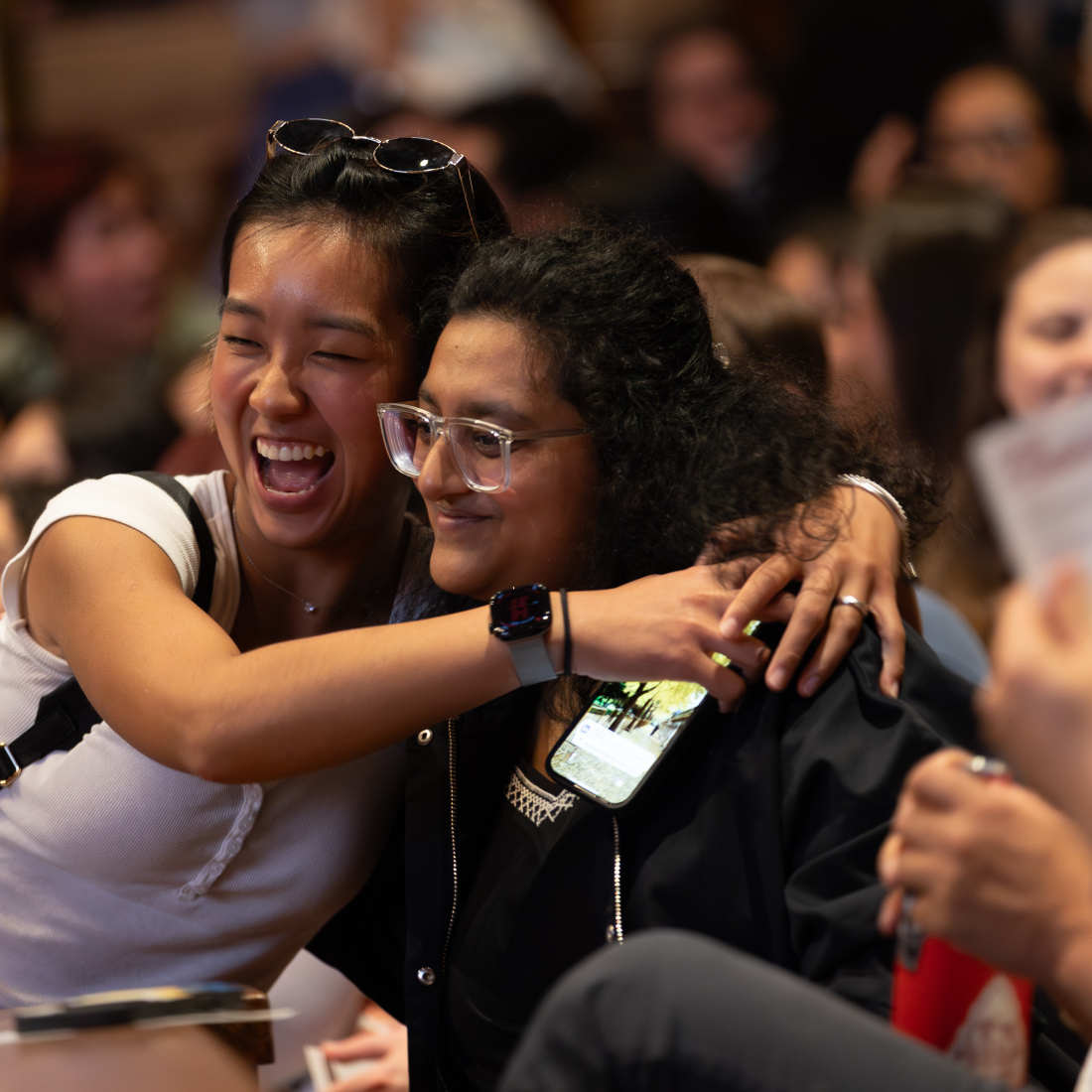 Two students embrace