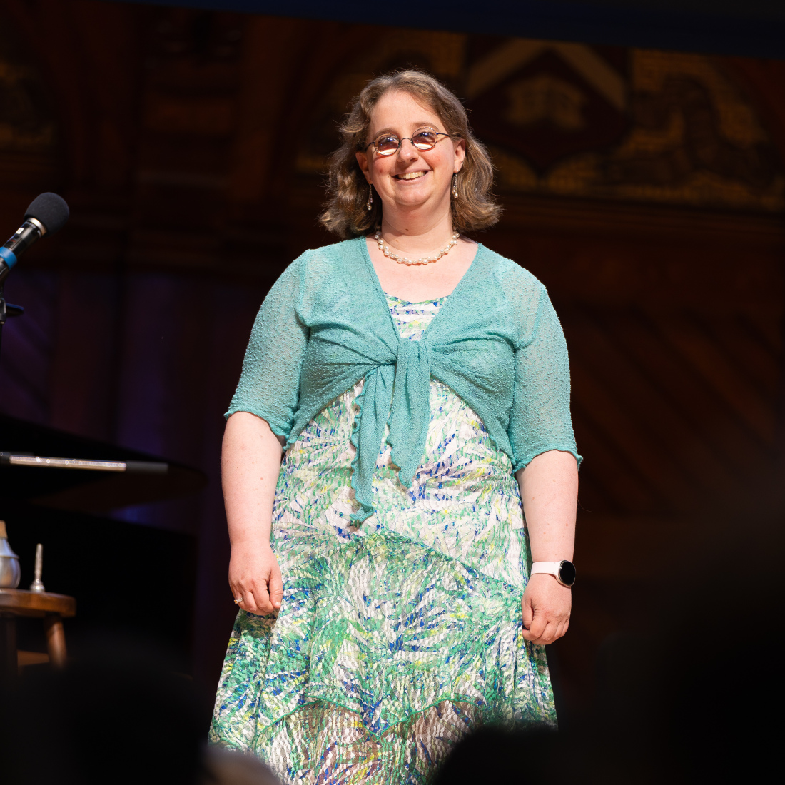 HGSE staff member Janet Ross takes the stage to sing "Old Mother Hubbard" 