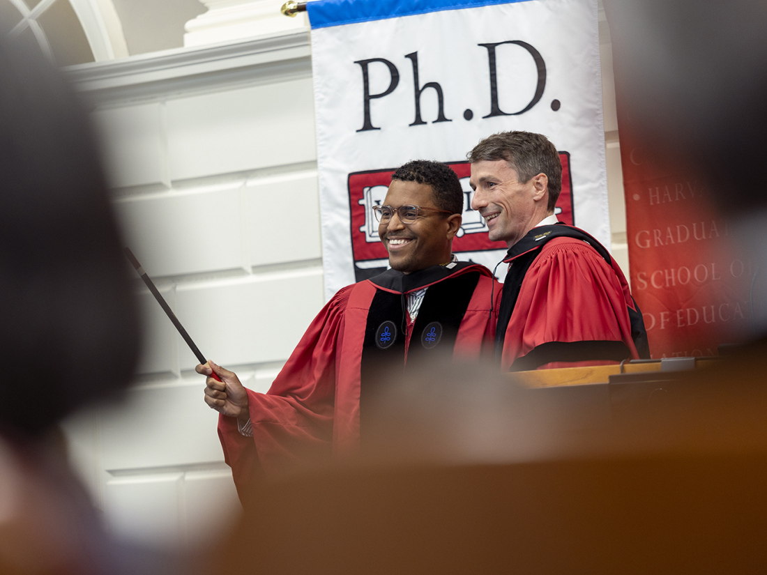 Ph.D. Commencement robing Martin West and Christopher Cleveland