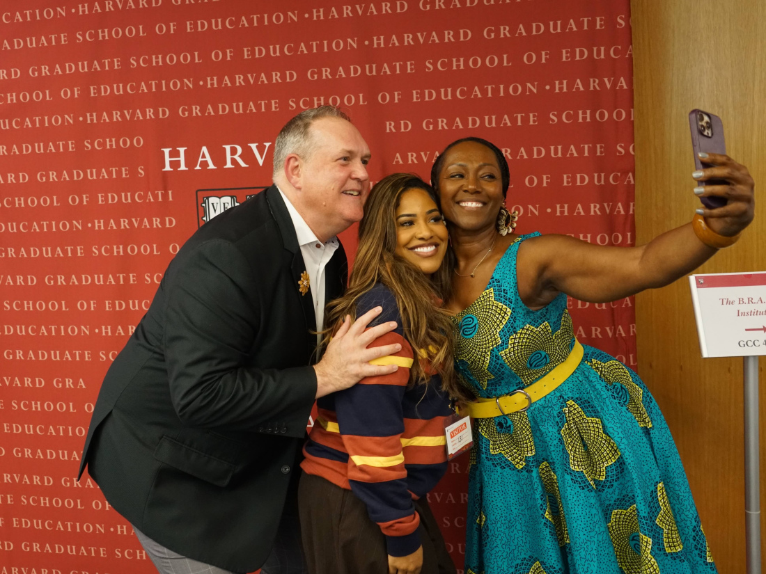 Faculty takes a selfie with participant